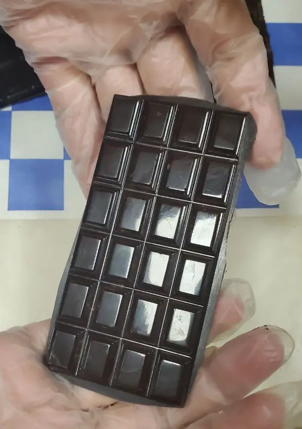 Closeup of 24 segment chocolate bar.